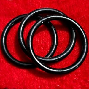3 black plastic bangle bracelets